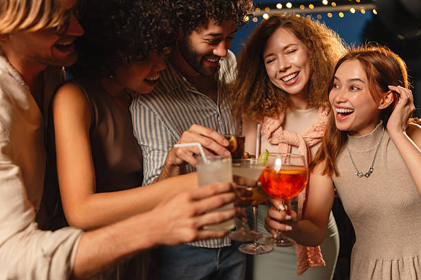 istock Friends enjoying cocktails on a rooftop 2193198114