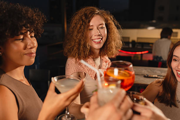 istock Female friends at the rooftop party 2193198140