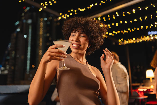 istock Happy woman dancing with a cocktail 2193198326