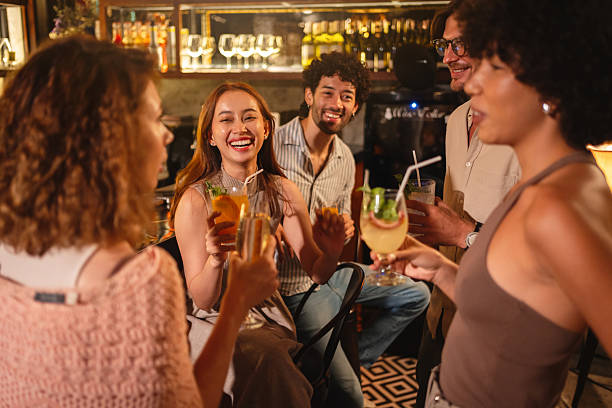 istock Friends enjoying cocktails at the bar 2193199236