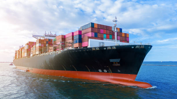 Aerial side view of cargo ship carrying container and running for export cargo yard port to custom ocean concept technology transportation , customs clearance, webinar banner forwarder mast