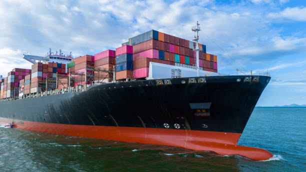 istock Aerial side view of cargo ship carrying container and running for export cargo yard port to custom ocean concept technology transportation , customs clearance, webinar banner forwarder mast 2193202325