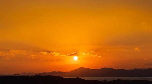 istock At dusk, the sun sets over the island. 2193202465