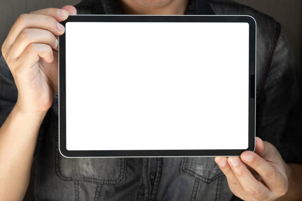 istock Man holding and showing tablet with a white screen and empty items in hand And his screen is showing free copy space for your ads. Technology concept 2193202470