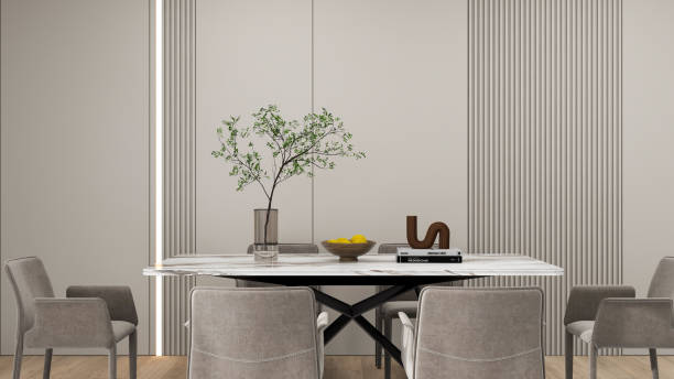 istock Close-up of a modern dining table with gray upholstered chairs, and minimalist decor including a vase with a branch, a bowl of lemons, and a stack of books. 3d rendering, decor idea. 2193202687