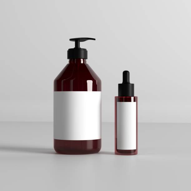 istock 3d render Dark Amber Pump Bottle and Dropper Glass Bottle Mockup on Minimalistic White Background 2193205914