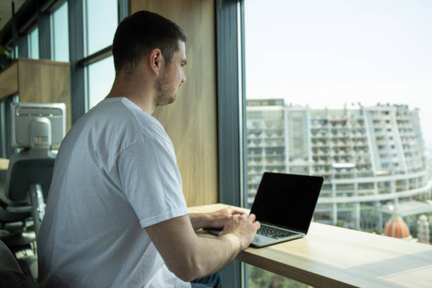istock A cheerful young entrepreneur works in a modern workspace 2193206907