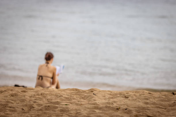 Young lady is relaxing on Sanur beach.Bali Island - Indonesia.