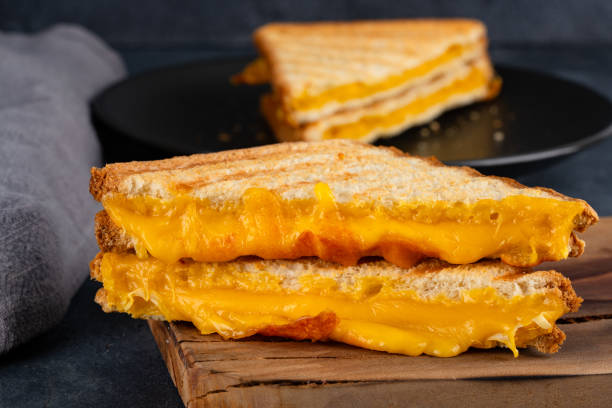 istock Arilled cheese sandwich. A sandwich made with melted cheddar cheese 2193207894