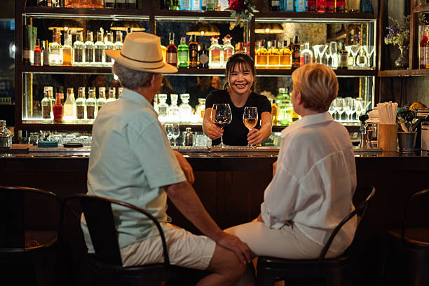 istock Bartender serving wine to a senior couple 2193207969