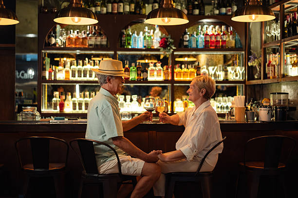 istock Senior couple smiling and toasting with wine 2193207975