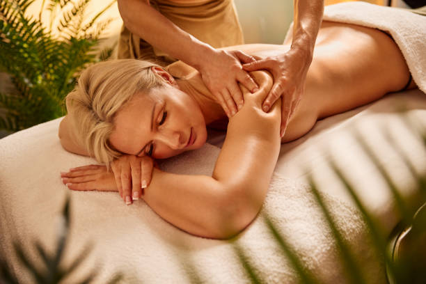 istock Women receiving massage therapy at spa 2193215097