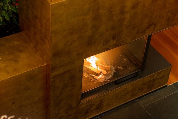 istock A luxurious fireplace with a crackling fire in a cozy living room 2193216680