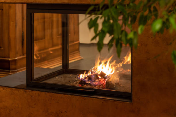istock A fireplace with a crackling fire in a cozy living room 2193216696