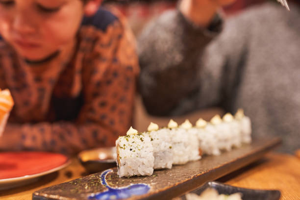 istock Close-up of sushi rolls on a decorative plate. 2193217427