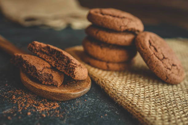 istock Chocolate brownie cookies on wooden spoon, sweets background 2193217478