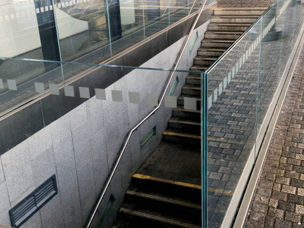 glass is attached to the wall using screws and washers intended for drilling into glass. the cladding is a railing and an air partition in the station hall, street, luxury, included, round