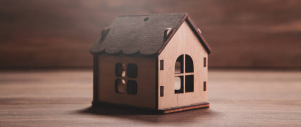 istock house on the wooden table 2193220440