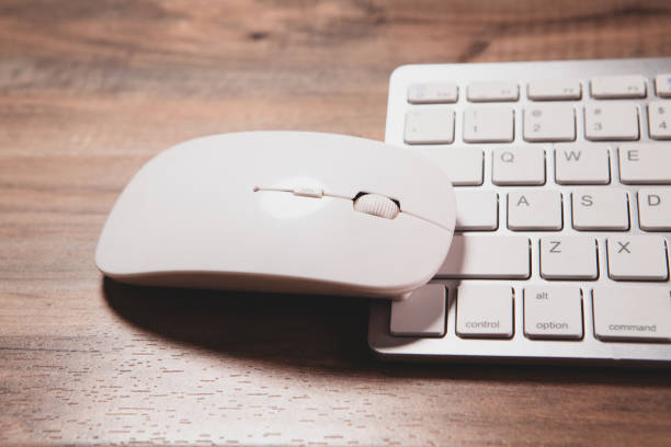 Modern desktop with computer keyboard, and notepad