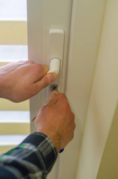 istock male hands unlocking locking the door with keys 2193221340