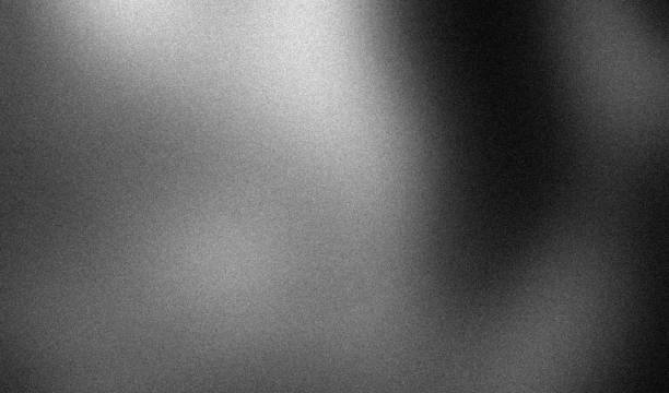 istock Grainy dark gradient carbon gray blurred abstract noise texture black and white monochrome plain background 2193221604