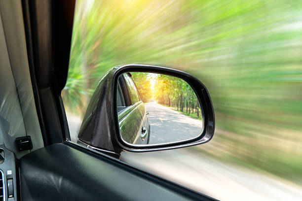 istock look in the rear view mirror of a car 2193222987