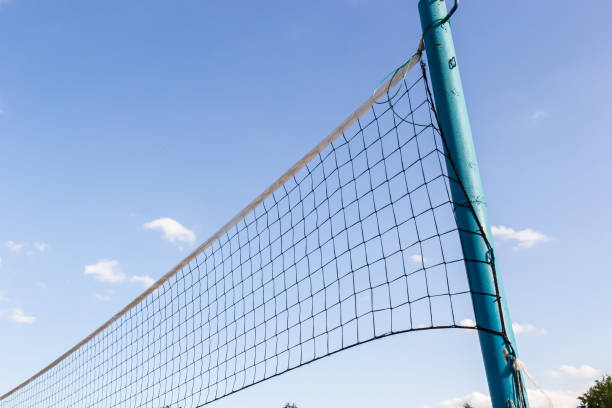 istock Bright blue sky highlights a volleyball net at a beach during a sunny afternoon 2193223028