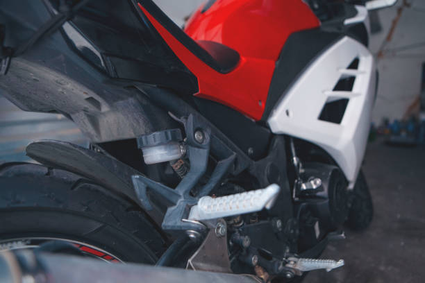 Closeup modern motorcycle wheel, with brake disc background with copy space, full frame horizontal composition
