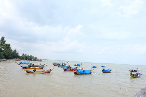 istock boats on the beach 2193223828
