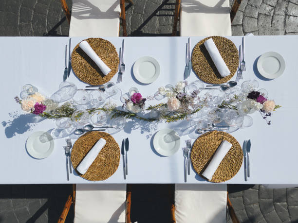 istock Elegant wedding table setting adorned with vibrant flowers and lush greenery, creating a stunning and inviting atmosphere perfect for a memorable celebration 2193224201