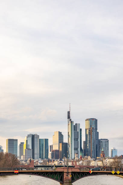 A big city in the evening at sunset. Modern buildings in a skyline on the river. High-rise buildings are reflected in the water. Modern architecture of the metropolis Frankfurt am Main, Germany