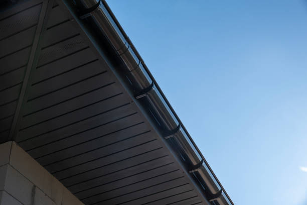 istock Metal soffit and gutter installation highlighting sleek design against a clear blue sky 2193225622