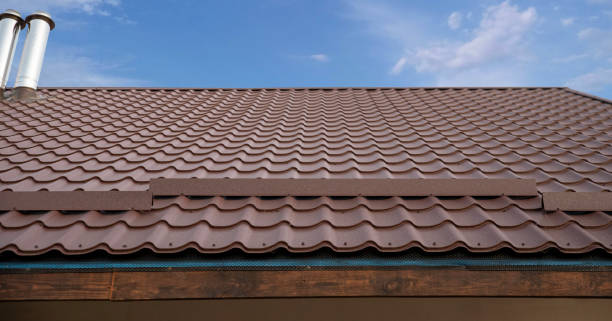 istock Brown metal snow guard installed on a corrugated tile roof. 2193225652