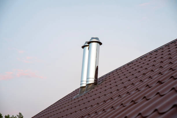 istock Stainless steel chimney smokestack pipe on the roof 2193225655