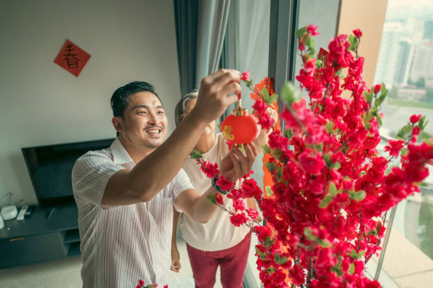istock Cherished Moments: A Son Helping His Mother for Chinese New Year 2193225890