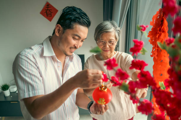 istock A Festive Touch: Mother and Son Celebrate Chinese New Year 2193225973