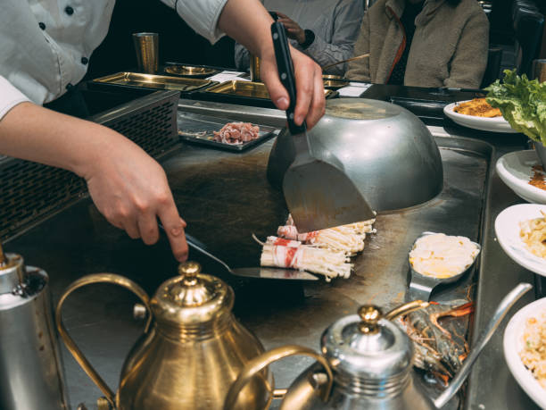 istock Japanese Chef Cooking Beef for Client teppanyaki style 2193226970