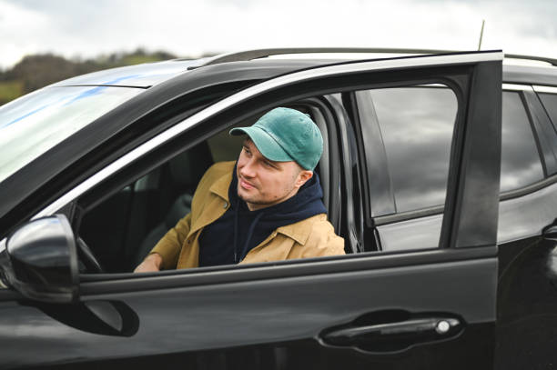 Mid adult man in car portrait.