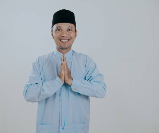 istock Moslem young asian man smiling to give greeting during Ramadan celebration. 2193227731