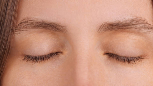 istock Closed eyes with natural eyelashes and brows. Serene People. Health Spa 2193228266