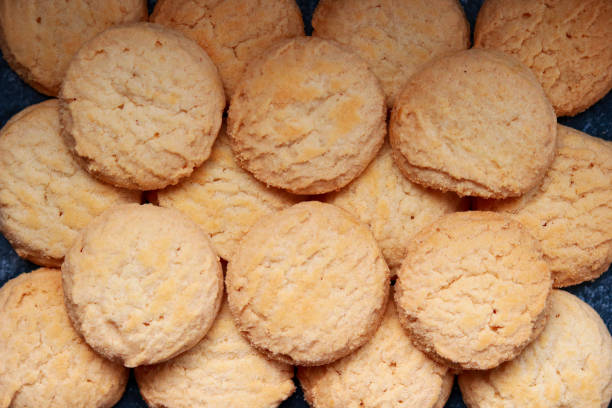 istock A pile of round cookies on a dark background. Top view. 2193229921