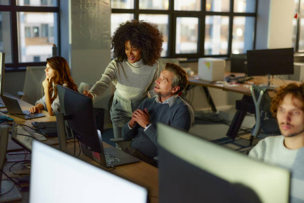 istock Diverse graphic designers working on desktop PC in the office. 2193229957