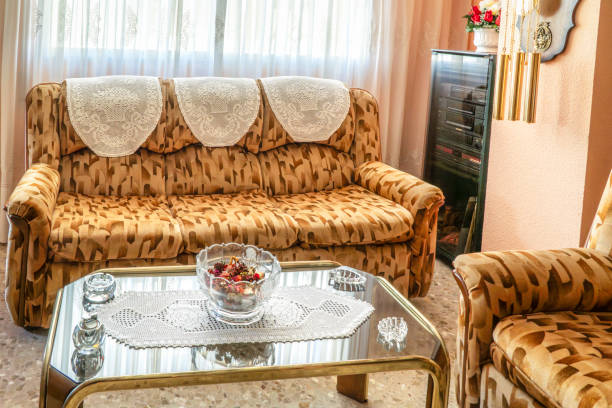 istock Comfortable patterned sofa and armchair  in a 1980s living room 2193231864