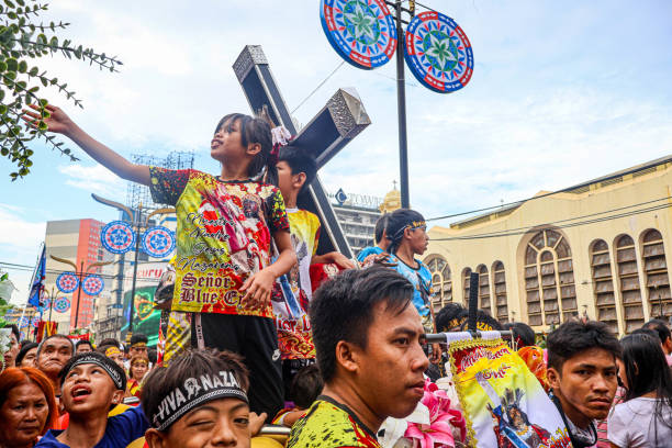 Manila, Philippines - A replica image of Jesus Nazarene is paraded across Quiapo, Manila as part of the celebration of Feast of Jesus Nazarene 2025. Devotees closely follows, assisting in the transportation of it while also expressing their faith. (Photo by Jack Solano/iStock by Getty Images)