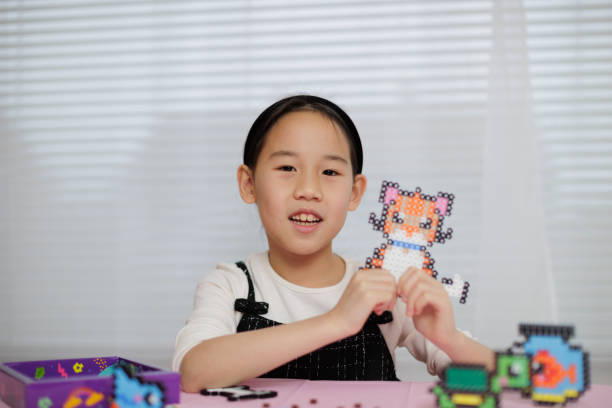 Girl making puzzle.