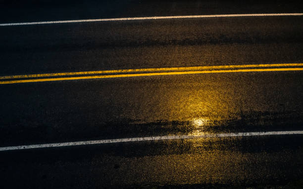 istock High angle view of a empty wet road after rain. 2193233177