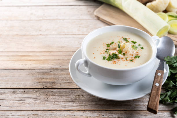 istock Cauliflower soup in bowl on wooden table 2193233643