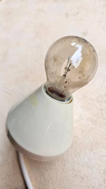 istock A light bulb with a socket holder, to be connected to an electric light installation. 2193233756