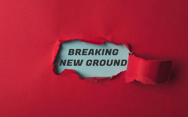 istock Red background with a black word that says Breaking New Ground 2193236590