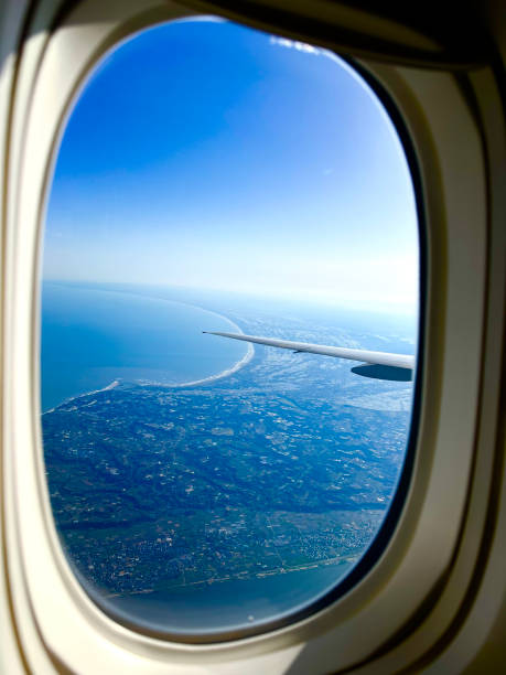 istock View of sky and land from aircraft window 2193236654